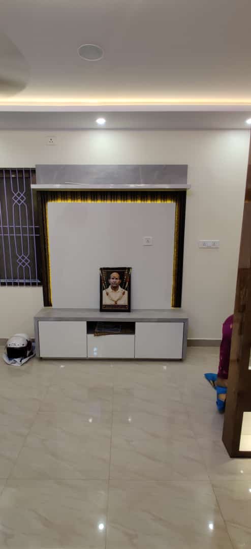 Modern white and grey TV entertainment unit with perimeter LED backlight