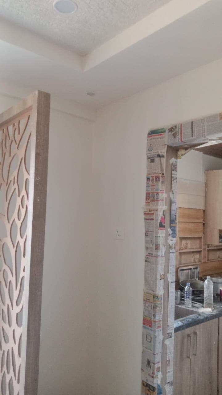 Precision CNC cut wooden jali screen partition between living and kitchen